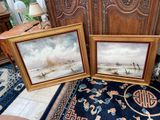 two framed paintings of boats on the water in a living room