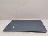 the laptop is sitting on the table with its lid open