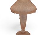 a glass mushroom on a pedestal on a white background