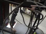 a close up of a bike with a bunch of wires attached to it