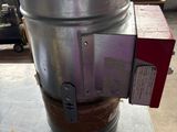 a large metal bucket sitting on top of a table