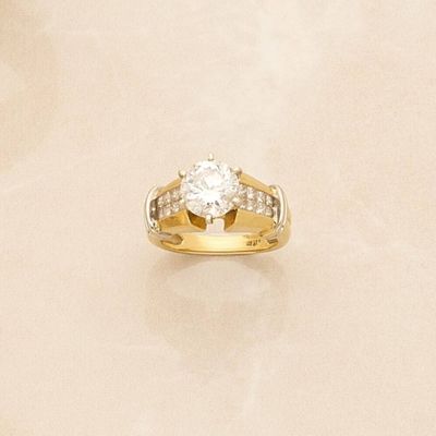 an image of a diamond ring on a white surface