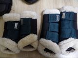 two pairs of boots that are sitting on a table