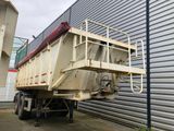 a dump truck that is parked in front of a building