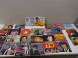 a table that has a lot of different album covers on it