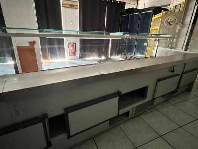 a counter that has a lot of glass on it