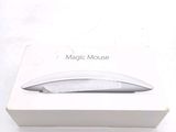 a white box with a mouse in it on a table