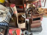 a pile of junk on the floor next to a chair
