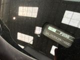 a close up of a car ' s dashboard with a clock on it