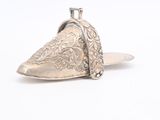 an image of a pair of silver shoes on a white surface