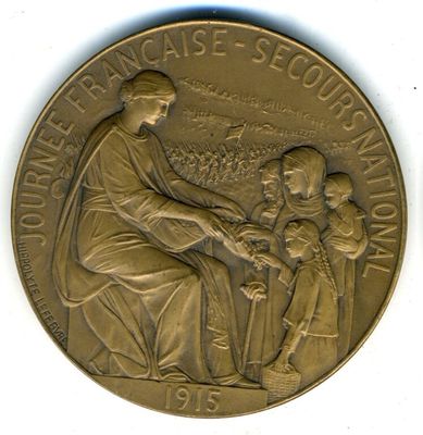 une image représentant une médaille de bronze sur laquelle figurent une femme et deux enfants