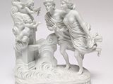a white statue of a man and a woman on a boat