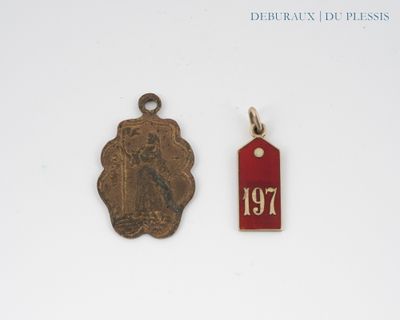 two small metal tags with a picture of a woman on them