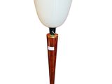 a lamp that has a wooden base and a glass shade on it