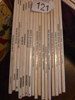 a lot of books on a table with a price tag