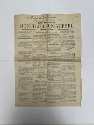 la une d'un journal sur laquelle figure la photo d'un homme tenant un journal
