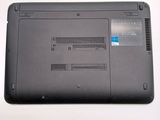 a close up of a laptop with a blue sticker on it