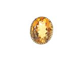 une bague ovale en citrine, dont la pierre centrale est entourée de petits diamants