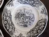 three black and white plates with a picture of a man and a woman on them