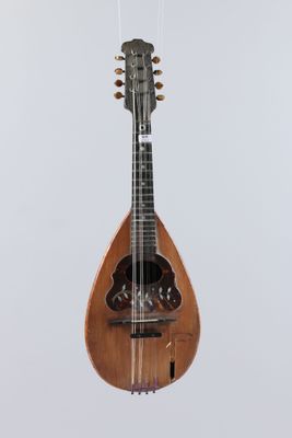 a close up of a mandolin hanging from a string