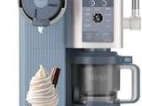 an ice cream cone sitting next to a coffee maker