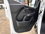 the door open of a white van with the door open