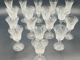 a lot of wine glasses that are sitting on a table