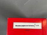 a red box with a label on it sitting on a table
