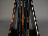 three books stacked on top of each other on a table