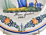 a plate with a picture of a woman holding a cane