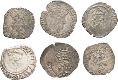 six silver coins of various sizes and shapes on a white background