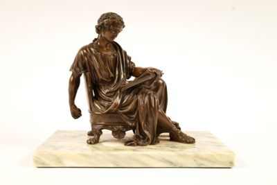 bronze statue of a woman sitting on a marble base with a dog