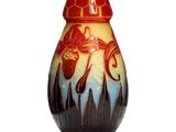 a vase that is sitting on a white surface