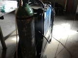 a propanene on a cart in a garage