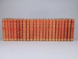 a stack of books sitting on top of each other on a table