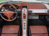 the interior of a sports car with leather seats and a steering wheel