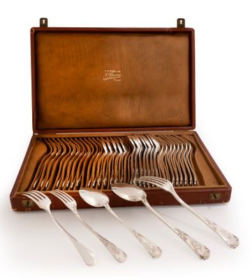 a set of silverware in a wooden case on a white background