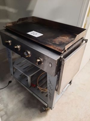 an old stove with a black top in a room
