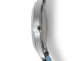 a close up of a watch on a white surface with a blue strap