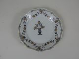 a plate with a picture of a woman on it