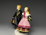 a figurine of a man and a woman dressed in military clothing