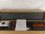 an open box with a piece of paper in it on top of a table
