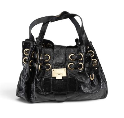 a black handbag with a gold buckle and chain handles