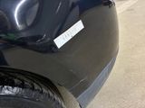 a black car with a sticker on the side of it