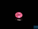 pink moon in the night sky with a reflection on the surface of the water