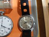 two watches sitting next to each other on a table