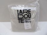 a bag with a label on it sitting on a table