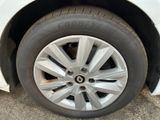 a close up of a tire on a white car