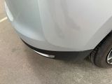a close up of the front of a car with a dent on it