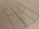 a cardboard box with a drawing of a tennis court on it